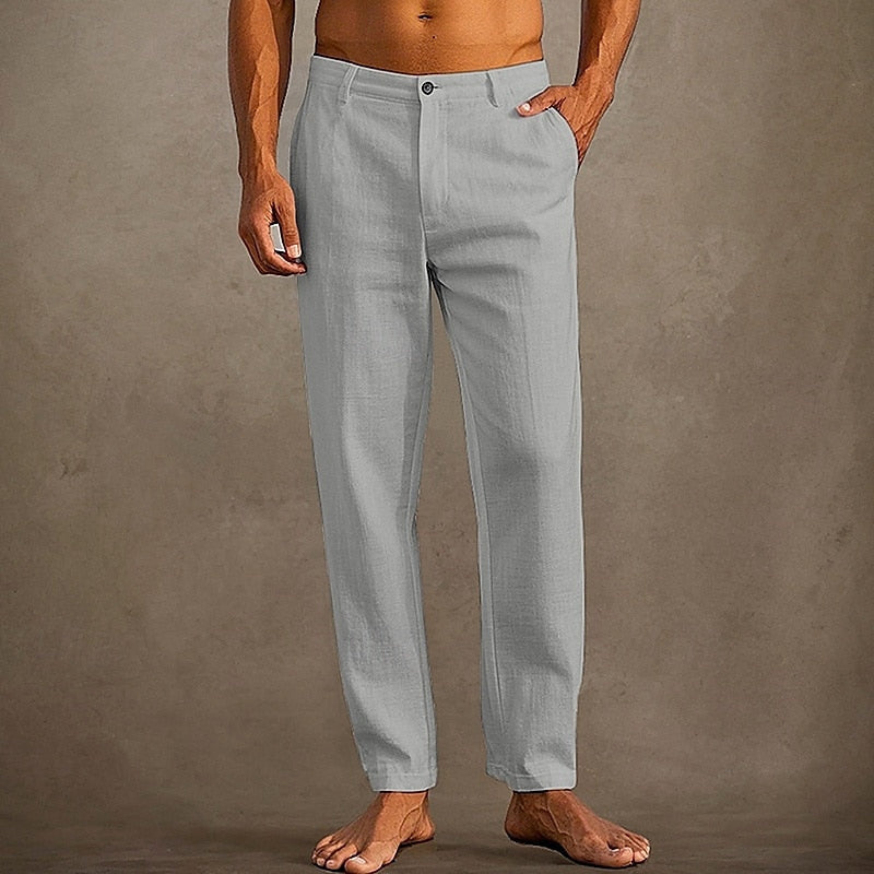 Pantalon d'été pour homme décontracté à coupe classique, tissu léger et fluide, adapté aux journées chaudes.