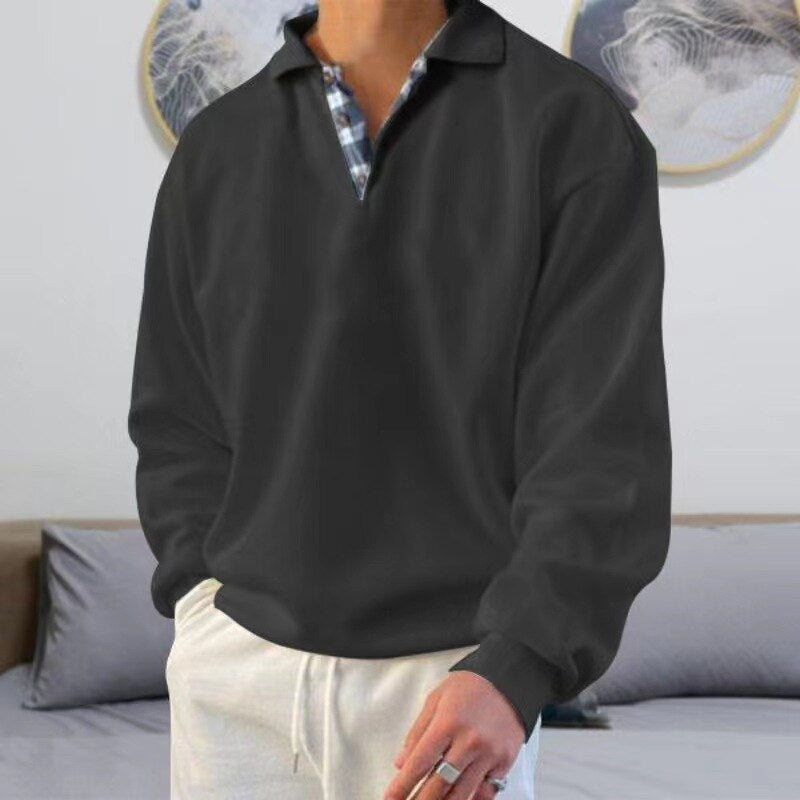 Pull léger à manches longues pour homme, de couleur noire avec un col polo à motif carreaux. Ce modèle moderne et élégant est parfait pour un look décontracté et confortable, idéal pour les journées fraîches d'été.